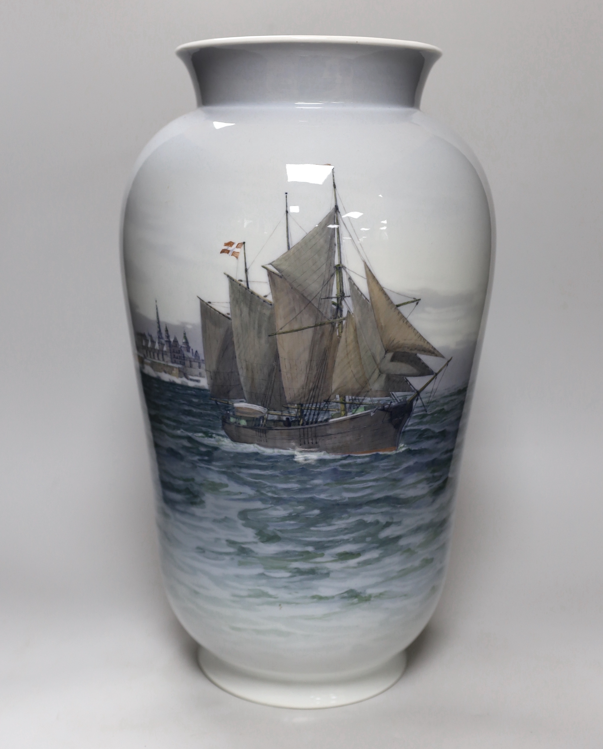 A large Royal Copenhagen vase with shipping scene, painted by Theodor Kjølner and dated 1938, height 44.5cm